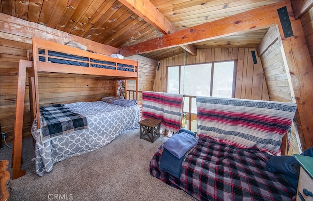 bedroom with wooden walls, carpet, and wooden ceiling