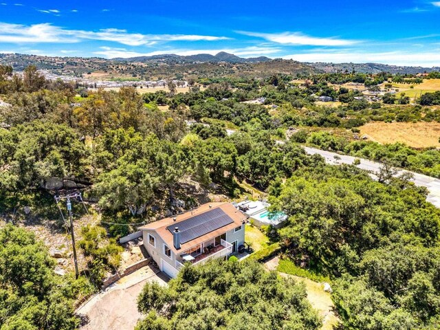 drone / aerial view featuring a mountain view