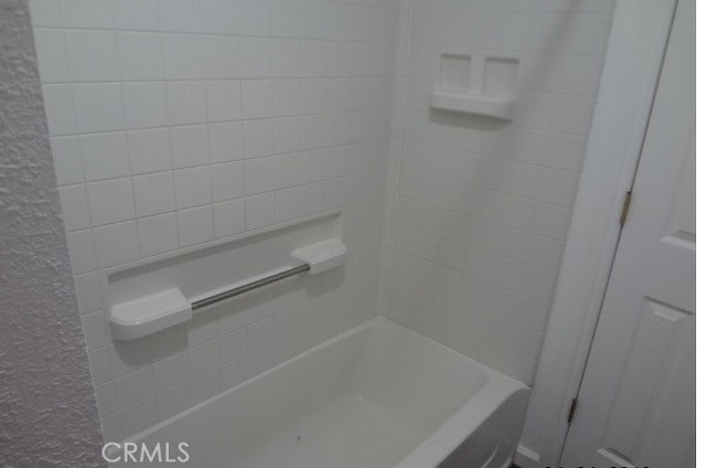 bathroom with shower / bath combination