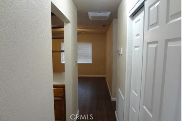 hall featuring dark wood-type flooring