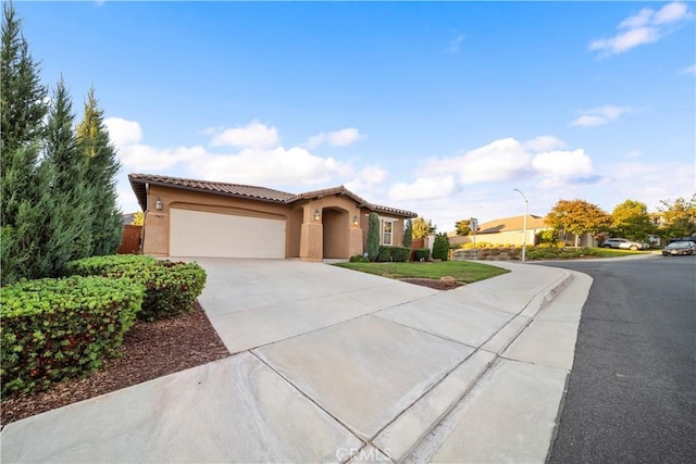 mediterranean / spanish-style home featuring a garage