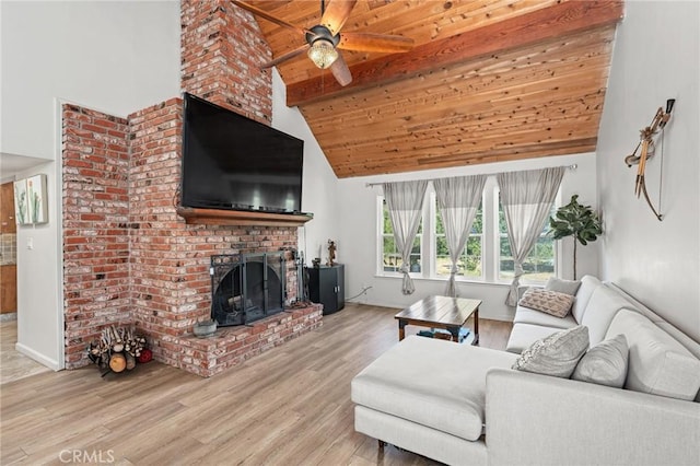 11319 Choctaw Dr, Bakersfield, CA 93308 - living area with light wood finished floors, a ceiling fan, high vaulted ceiling, a brick fireplace, and a wooden ceiling with exposed beams