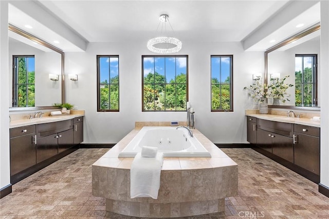 bathroom featuring vanity and a wealth of natural light