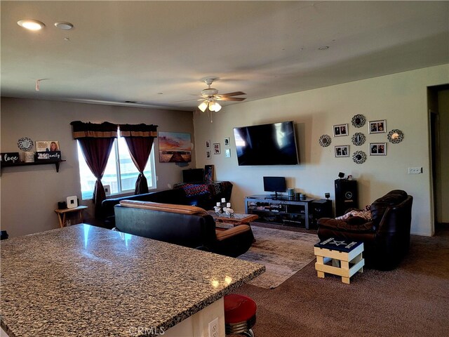 living room with carpet and ceiling fan