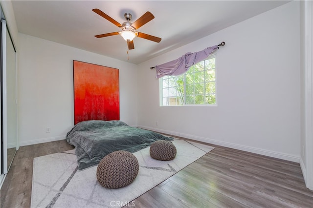 bedroom featuring hardwood / wood-style flooring and ceiling fan