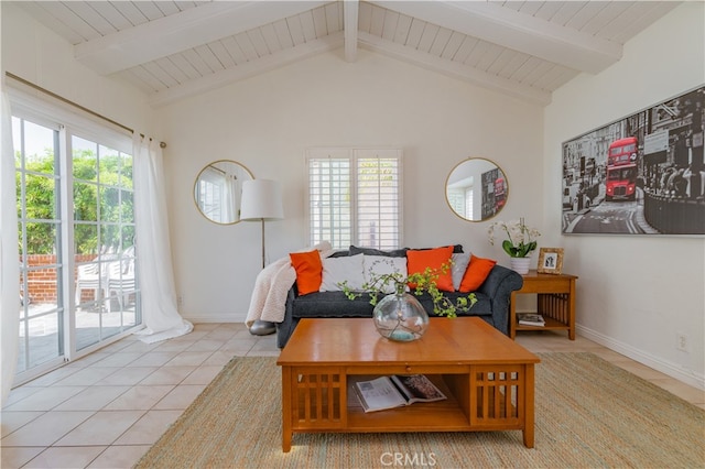 tiled living room with lofted ceiling with beams and a healthy amount of sunlight