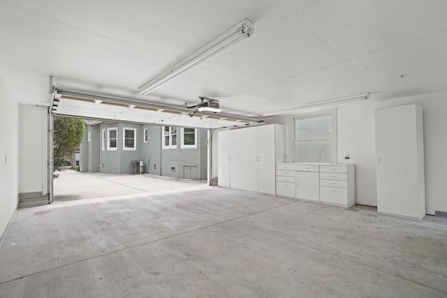 garage with cooling unit and a garage door opener