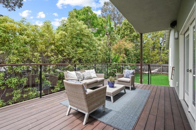 wooden terrace featuring an outdoor living space