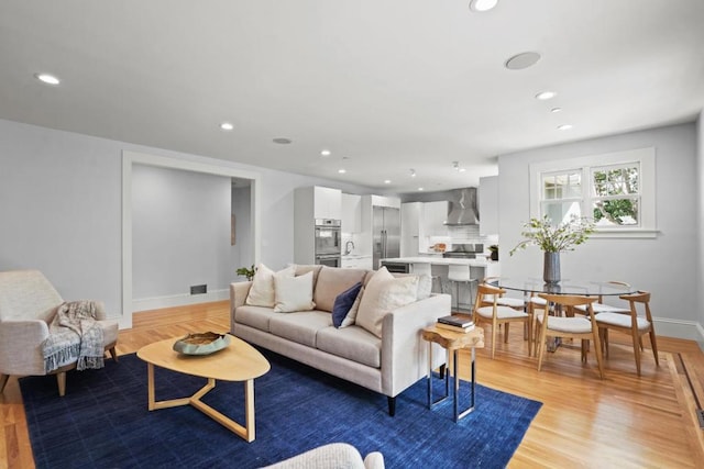 living room with light hardwood / wood-style floors