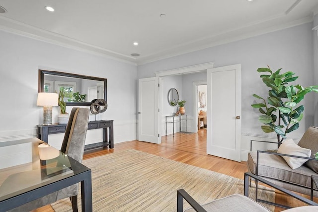 office space with hardwood / wood-style flooring and crown molding