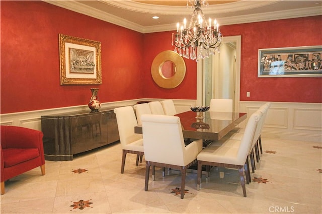 dining area featuring light tile patterned floors, an inviting chandelier, and ornamental molding