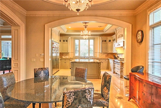 dining room featuring an inviting chandelier and crown molding