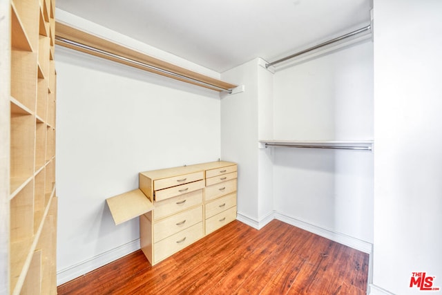 walk in closet featuring dark hardwood / wood-style flooring