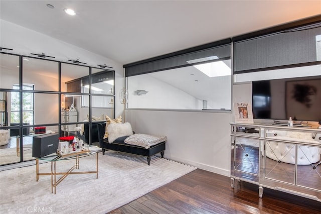 living room with dark hardwood / wood-style flooring and lofted ceiling