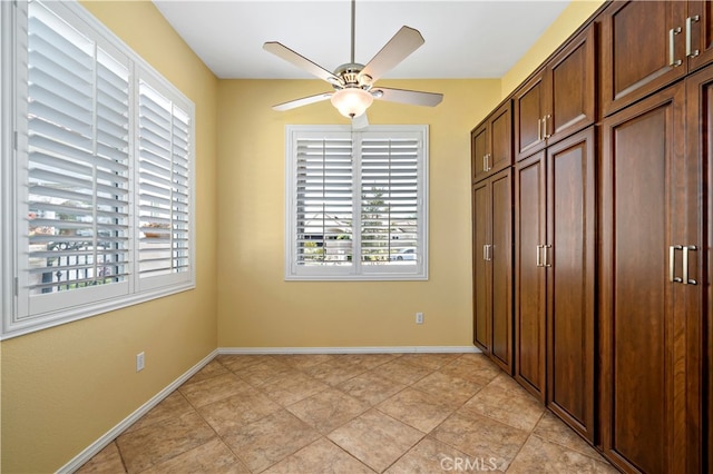 unfurnished bedroom with a closet, ceiling fan, and light tile patterned floors