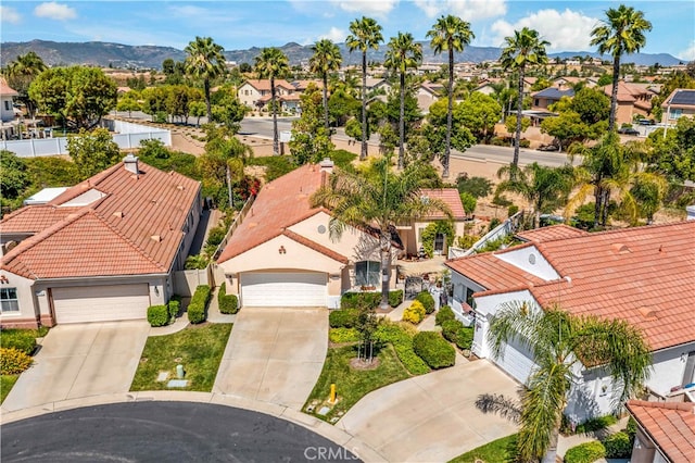 birds eye view of property with a mountain view