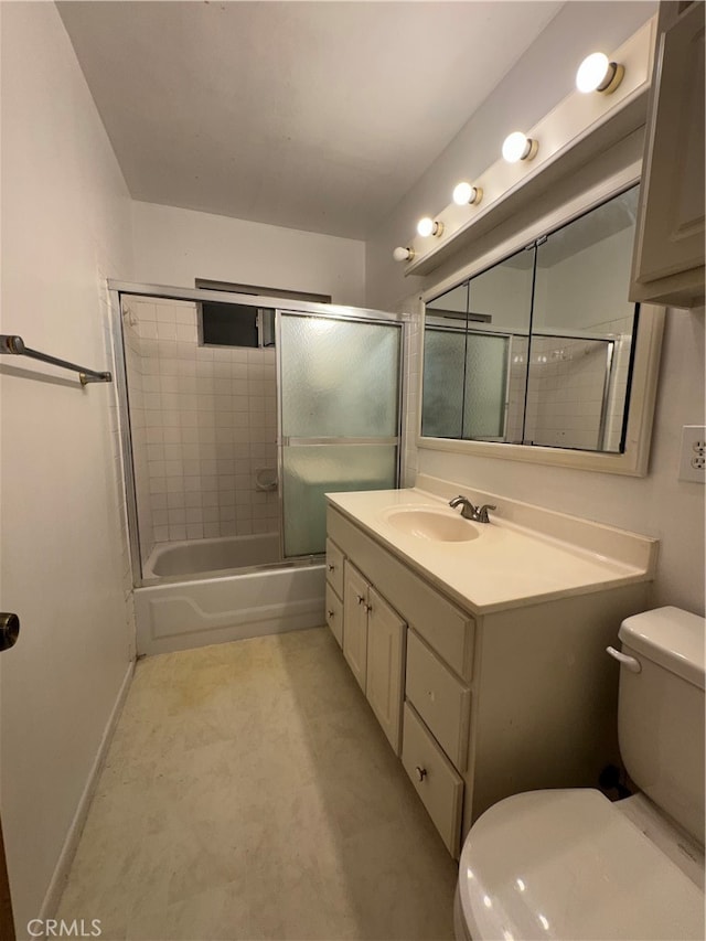 full bathroom featuring shower / bath combination with glass door, vanity, and toilet