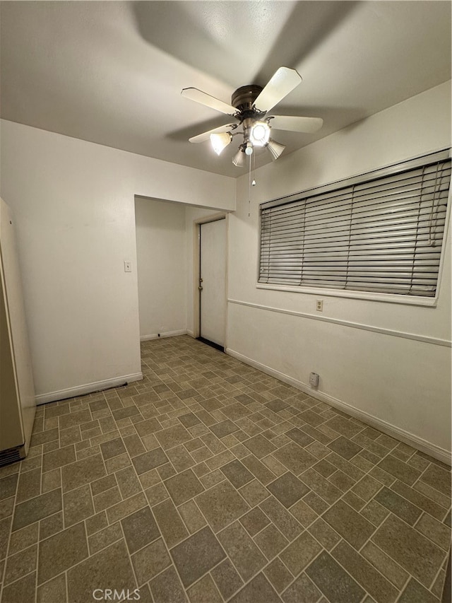 unfurnished bedroom with a closet and ceiling fan