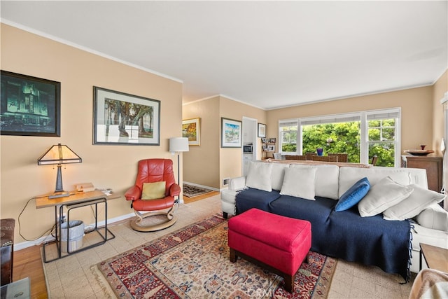 living room with light hardwood / wood-style flooring and ornamental molding