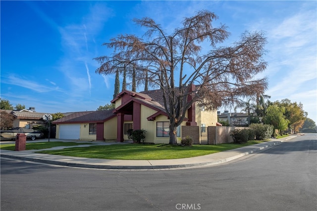 view of front of house with a front lawn and a garage