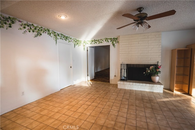 unfurnished living room with a fireplace, a textured ceiling, and ceiling fan