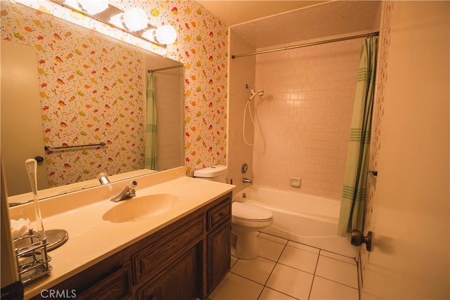 full bathroom featuring vanity, shower / bath combo with shower curtain, toilet, and tile patterned floors