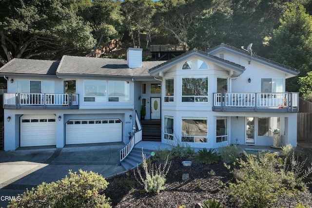 view of front of house with a balcony and a garage