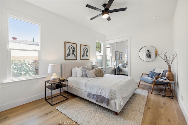 bedroom featuring ceiling fan and light wood-type flooring