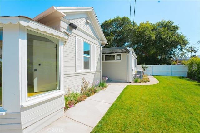 exterior space with a yard and central air condition unit