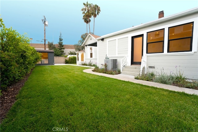 exterior space with central air condition unit and a storage unit