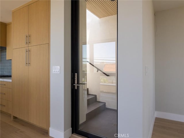 staircase featuring hardwood / wood-style flooring