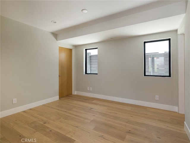 spare room with light hardwood / wood-style floors