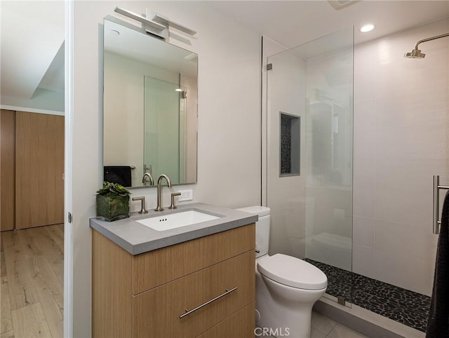 3100 Tennyson Pl, Hermosa Beach, CA 90254 - full bathroom with toilet, vanity, tiled shower, and wood finished floors