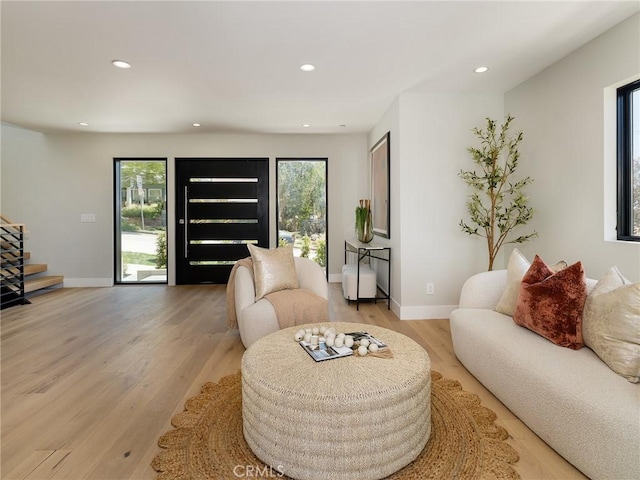 3100 Tennyson Pl, Hermosa Beach, CA 90254 - living area with healthy amount of natural light, recessed lighting, light wood-type flooring, stairway, and baseboards