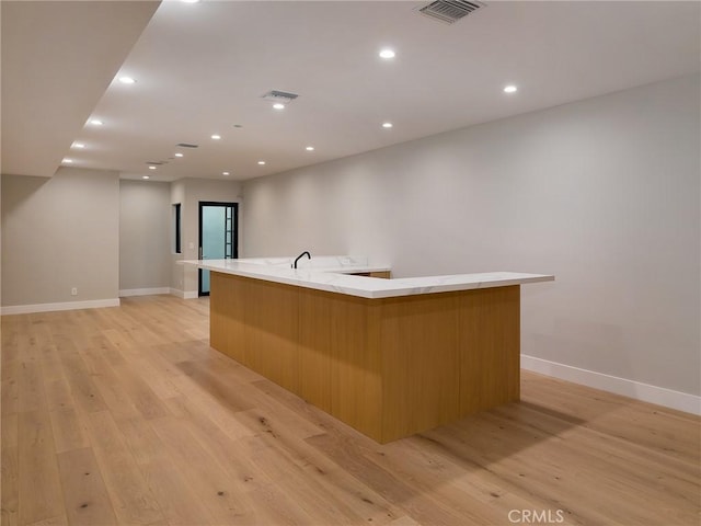 3100 Tennyson Pl, Hermosa Beach, CA 90254 - kitchen with a large island with sink, light wood-type flooring, baseboards, modern cabinets, and recessed lighting