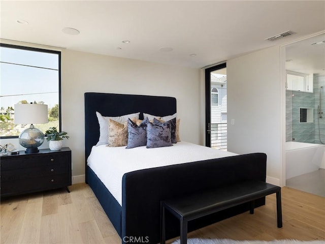 bedroom with light wood-type flooring