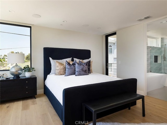3100 Tennyson Pl, Hermosa Beach, CA 90254 - bedroom featuring multiple windows, light wood-style floors, and connected bathroom