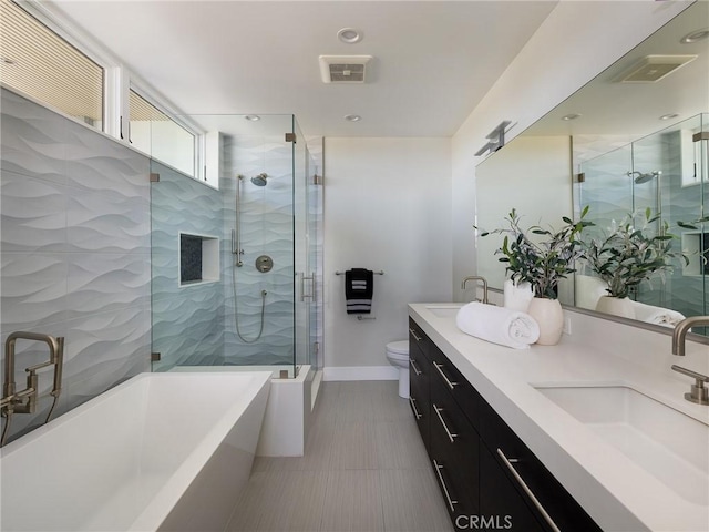 3100 Tennyson Pl, Hermosa Beach, CA 90254 - full bath featuring a stall shower, a freestanding bath, double vanity, baseboards, and toilet