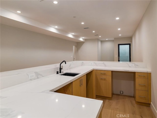 3100 Tennyson Pl, Hermosa Beach, CA 90254 - kitchen with a sink, light wood-style flooring, light stone countertops, brown cabinets, and recessed lighting