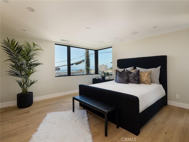 bedroom with light wood-type flooring