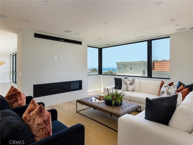 3100 Tennyson Pl, Hermosa Beach, CA 90254 - living room featuring wood finished floors, a glass covered fireplace, and recessed lighting