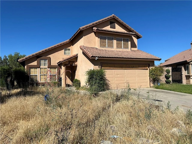 view of front of property with a garage