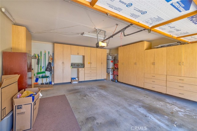 garage featuring water heater and a garage door opener