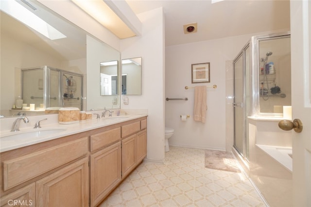 bathroom featuring toilet, walk in shower, and vanity