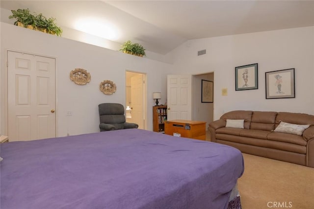 carpeted bedroom featuring lofted ceiling