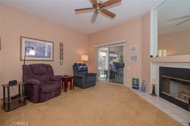 living area featuring ceiling fan and light tile patterned floors