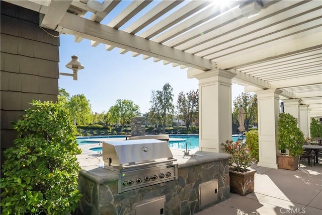 view of patio with a pergola, a grill, sink, and exterior kitchen