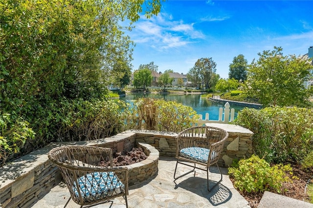 view of patio with a water view