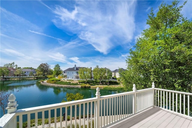 wooden deck featuring a water view