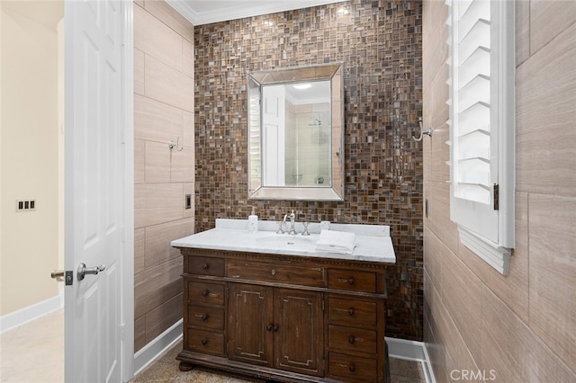 bathroom featuring vanity, tile walls, and ornamental molding